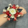 White spray roses and mini red carnation with gold , black ribbon