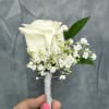 White rose boutonni&egrave;re with silver wrapping 
