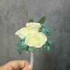 Three White spray roses with aqua fillers and silver wrap boutonni&egrave;re 