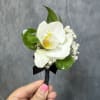 White orchid boutonni&egrave;re.
Ribbon color can be customized as requested 