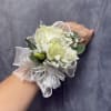 Beautiful wrist corsage with white rose , white lisianthus , whit ribbon