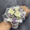 Cream-white spray roses and white alstroemeria with lavender fillers on a sheer