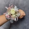 White spray  roses with delicate pink fillers, finished with silver and