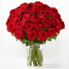 Bouquet of red roses in a clear glass vase