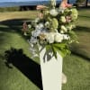 Pedestals rentals are $50 each. Large in season green and white floral