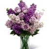 A graceful blend of soft lavender roses, rich purple stock, and delicate