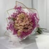 Bouquet of blush roses with bright pink filler flowers
