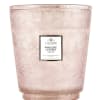 Pink patterned candle in a decorative glass vessel