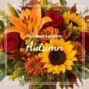 Autumn bouquet with sunflowers, red roses, and orange lilies