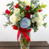 This timeless bouquet features a lush mix of red roses, white and