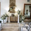 All white seasonal flowers. Includes 4 baskets , 2 flower pieces for