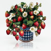 Strawberry-themed arrangement in a blue checkered tin with white flowers