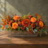 Orange roses and mums arranged in a rustic wooden box