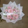 Pink gerbera daisy bouquet with a "Para Mi Princesa" ribbon
