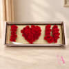 Red roses arranged to spell "I ♥ U" in a rectangular box