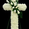 A timeless and elegant cross arrangement composed of lush white carnations, symbolizing