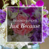 Pink roses and purple orchids in a glass vase with "Just Because" text overlay