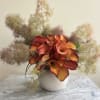 30 Calla Lillis and Smoke Bush in ceramic vase. 
