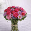 Description: A lush and charming blend of hot pink roses, soft blush