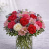  Description: A passionate and elegant arrangement featuring vibrant red roses, soft