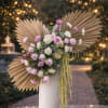 A dramatic and modern designer arrangement featuring premium blush and ivory roses