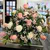 Large bouquet of pink roses and white carnations with baby's breath