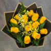 Bouquet of yellow roses with small white filler flowers