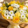 Yellow and white bouquet with roses and daisies wrapped in paper