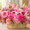 A lush mound of pinks and peaches greets the eye-this rounded basket