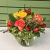 Mixed bouquet of roses and hydrangea in a glass vase