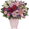 Pink and white mixed bouquet in a pink glass vase