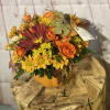 Orange spray roses, yellow daisy, sunflowers and more. Perfect autumn centerpiece or