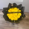 Yellow rose bouquet wrapped in black paper with a "I LOVE YOU" ribbon