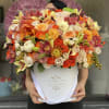 This very feminine orange and white arrangement is a must during the