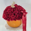 75 red roses in an pumpkin 