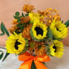 Bouquet of yellow sunflowers and orange mums tied with an orange ribbon