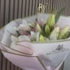 Soft white and blush-pink lilies take center stage in this Lily Lovers