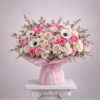 Large bouquet of pink and white roses with anemones wrapped in pink paper