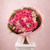 Pink bouquet of roses and lisianthus wrapped in pale pink paper