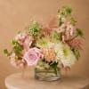 Pink and white mixed bouquet in a clear glass vase