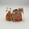 Gift basket with chocolates in a clear acrylic box and a decorative pumpkin pouch