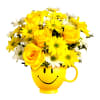 Yellow roses and daisies arranged in a smiley-face mug