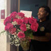 Large bouquet of hot pink roses in a glass vase