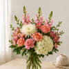 Pink and white mixed bouquet in a clear glass vase