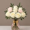 Choose a soft, romantic centerpiece that feels both personal and polished -