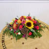 Colorful mixed flower arrangement on a round table