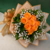 Tightly clustered bright orange roses form the heart of this Citrus Orange