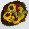 Bright yellow sunflowers paired with clustered red roses create a bold, celebratory
