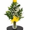 Yellow roses with white baby's breath in a clear vase with a yellow bow