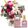 A lush cluster of pink and white roses with creamy white lilies